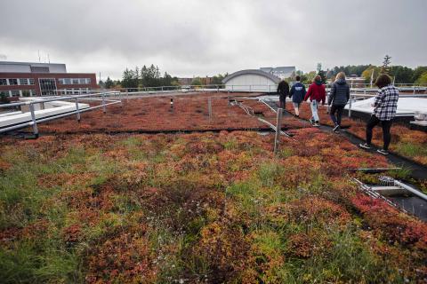 UVM students tour the green roof atop the Aiken Center—home to the Rubenstein School of Environment and Natural Resources—on campus in Burlington, VT.