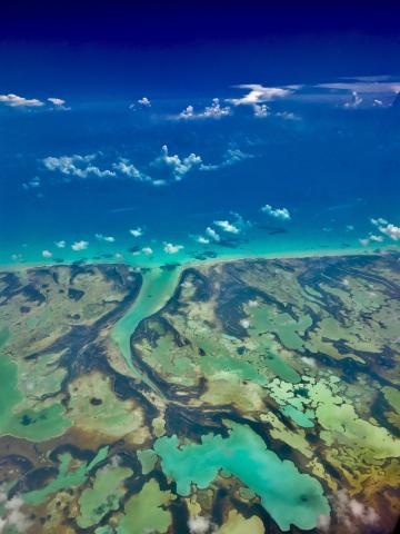 Winning photo from the previous year, shows an aerial view of the ocean